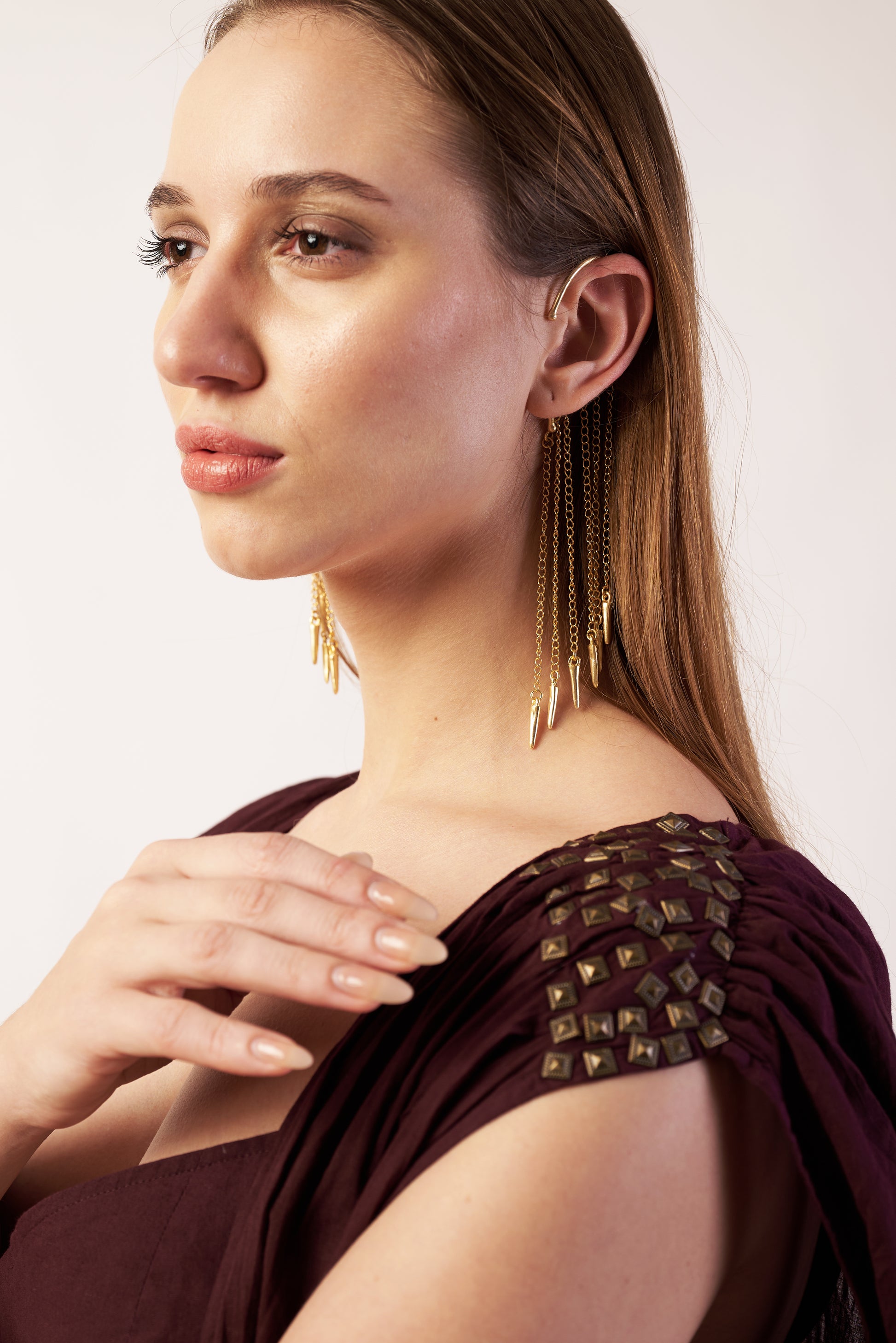 Woman wearing gold earrings and a coca cola camisole with embellishments. | Women's Overlay & Camisole | Jacket | Pret Clothes | nEo Clothes.