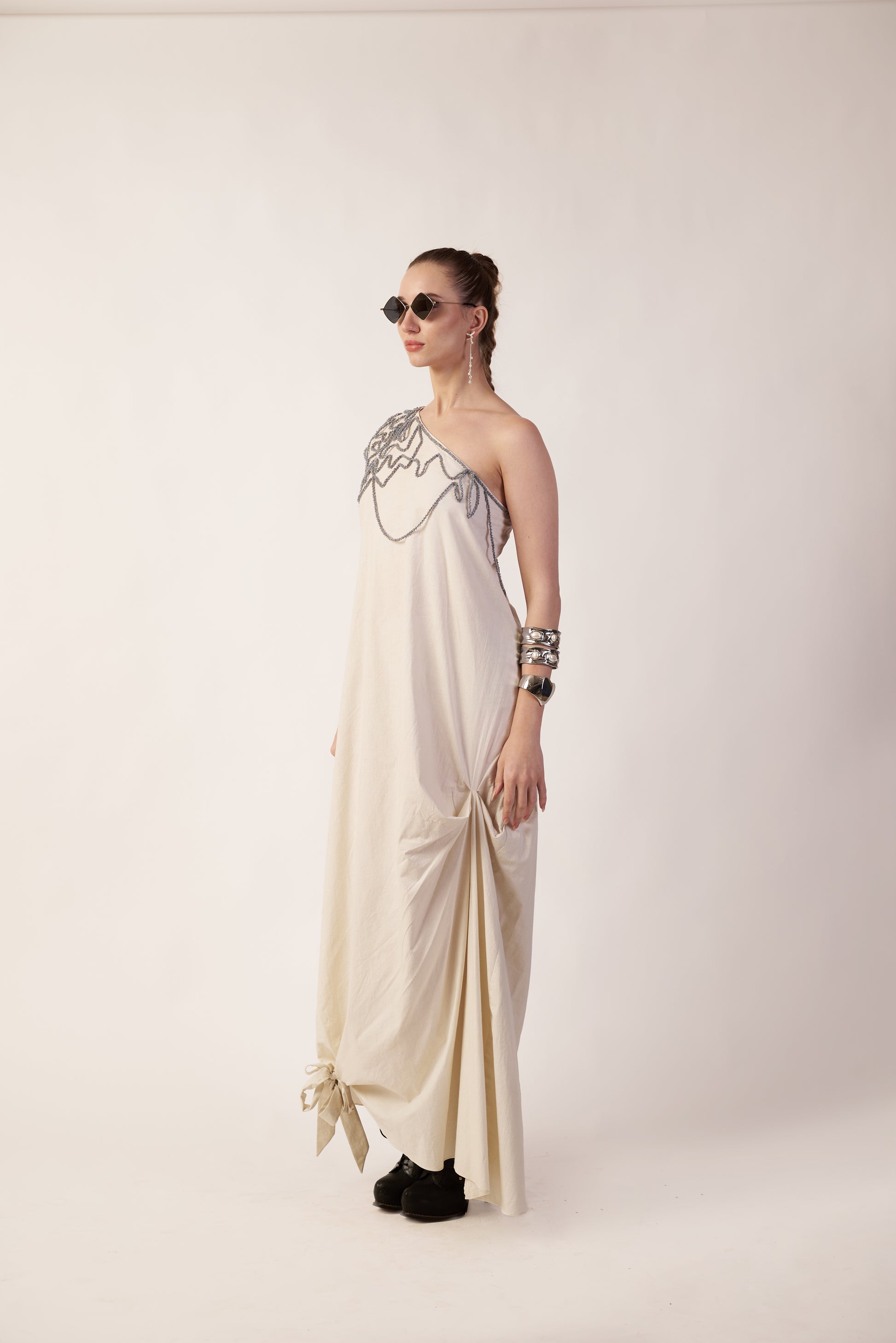 Woman wearing a one-shoulder dress with silver embellishments | Women Dresses | Pret Clothes | nEo Clothes.