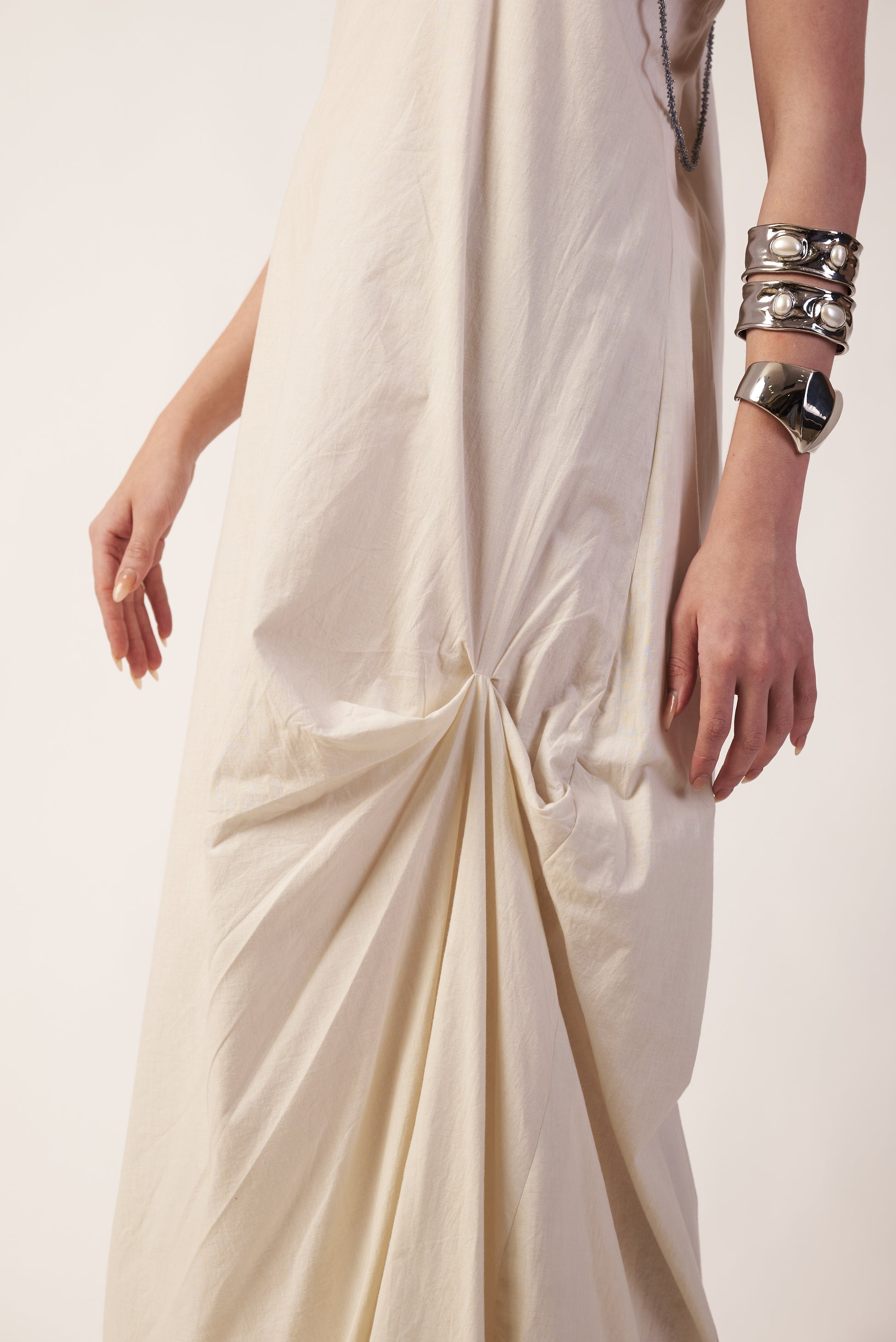 Close-up of a person wearing a white dress with silver jewelry  | Women Dresses | Pret Clothes | nEo Clothes.