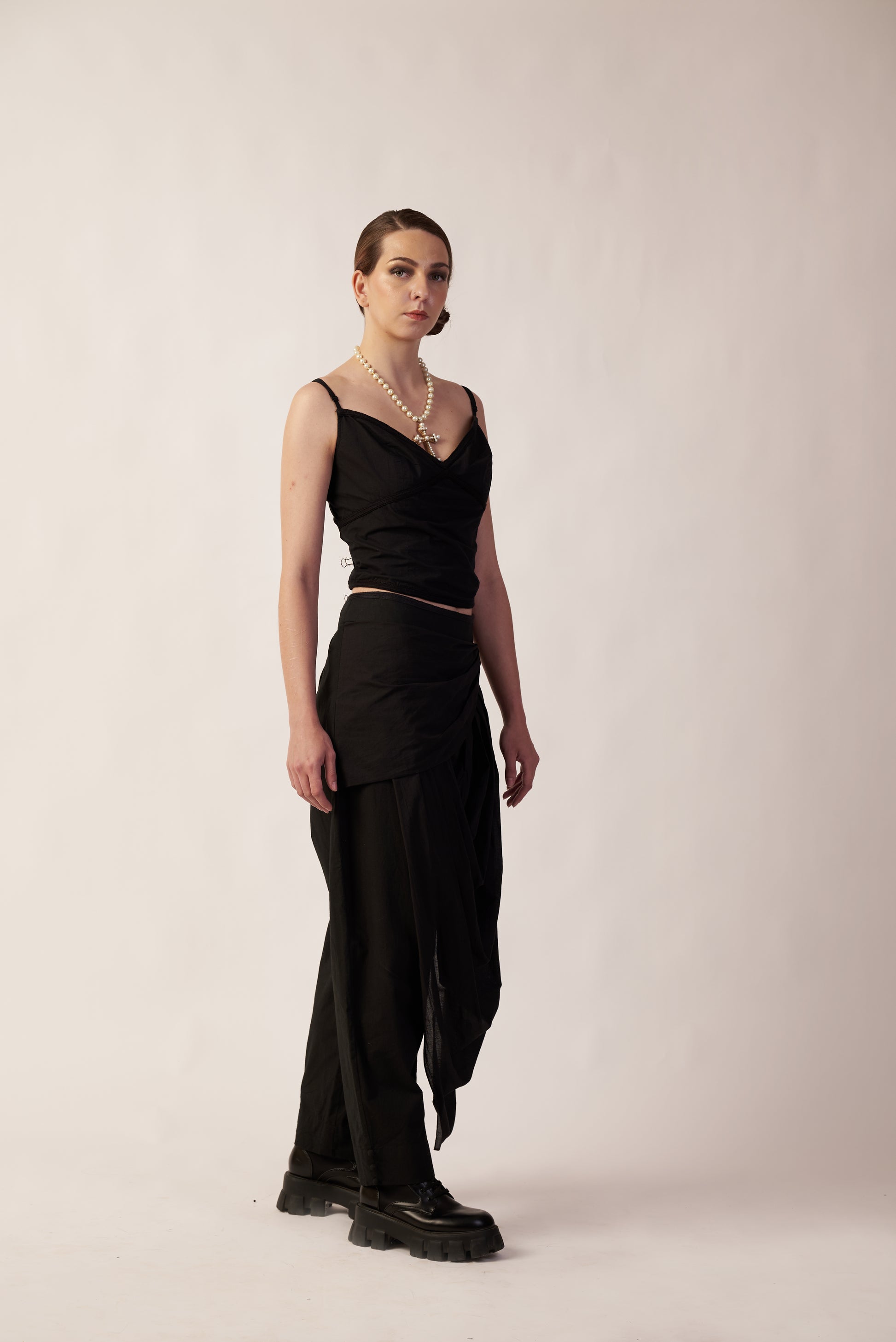 Woman wearing a black dress with a draped skirt  | Women Co-ord Set | Pret Clothes | nEo Clothes.