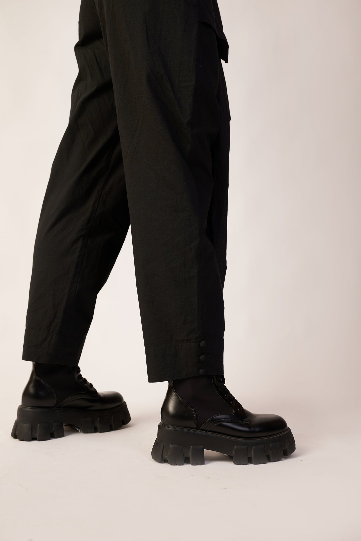 Person wearing black pants and black shoes| Women's Pant | Pret Clothes | nEo Clothes