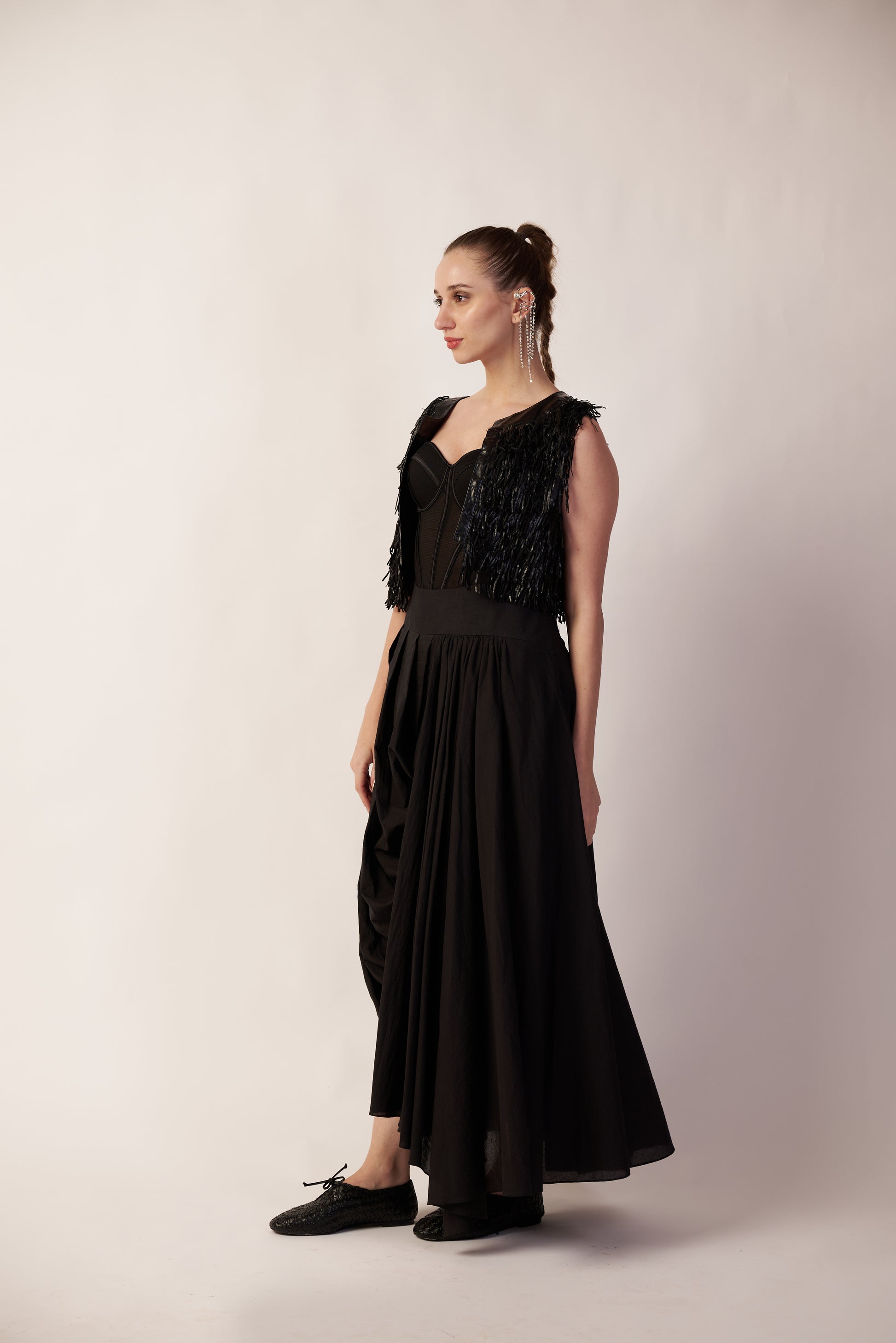 Woman wearing a black pant with floral details  | Women's Pants | Bottoms | Pret Clothes | nEo Clothes.