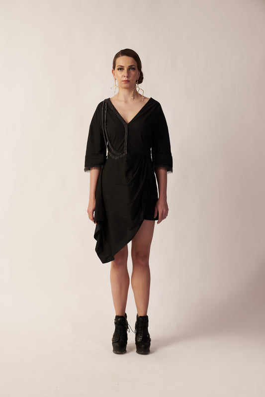 Woman wearing a black dress with a draped neckline  | Women Dresses | Pret Clothes | nEo Clothes.