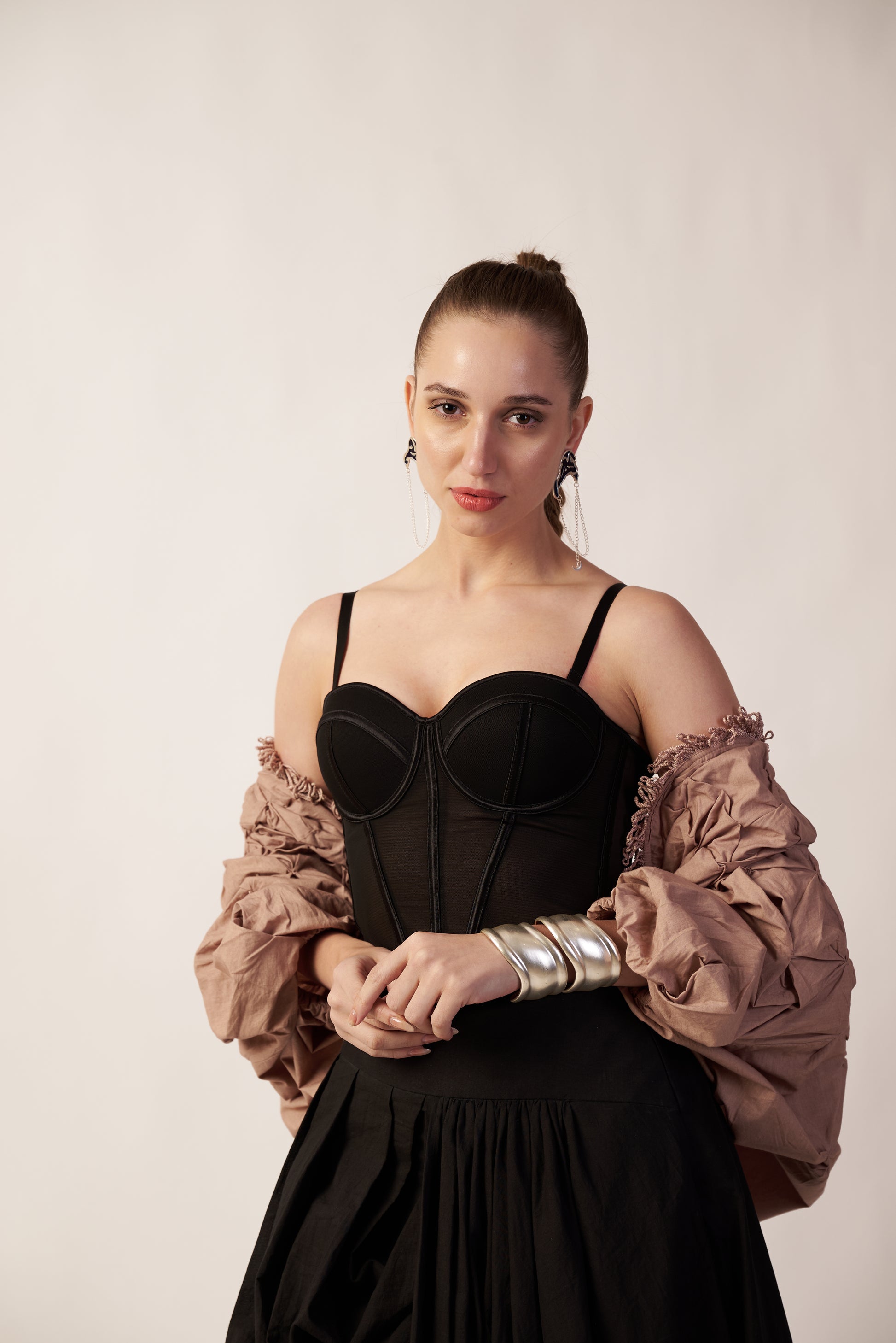 Woman wearing a black dress with a beige shrug | Women's Shrug | Jacket | Pret Clothes | nEo Clothes.