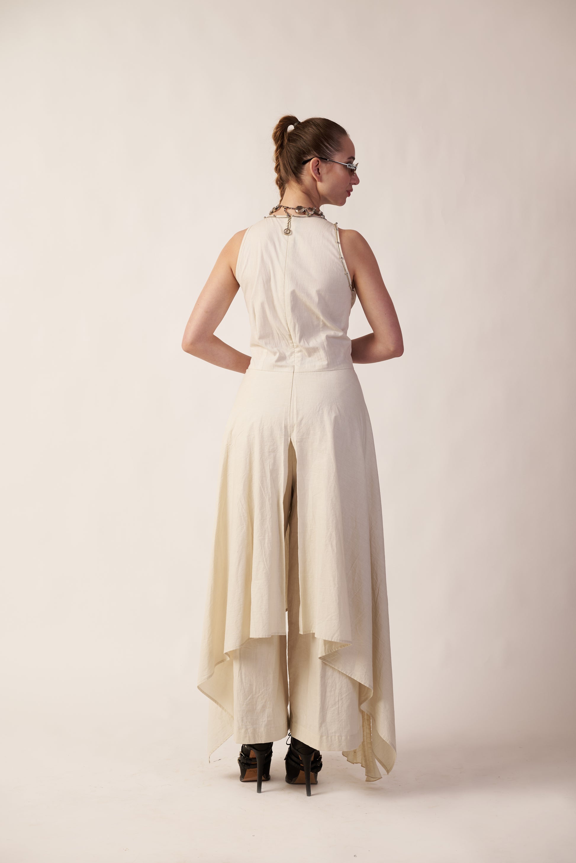 Woman wearing a white dress with a high-low hem  | Women Jumpsuit | Pret Clothes | nEo Clothes.