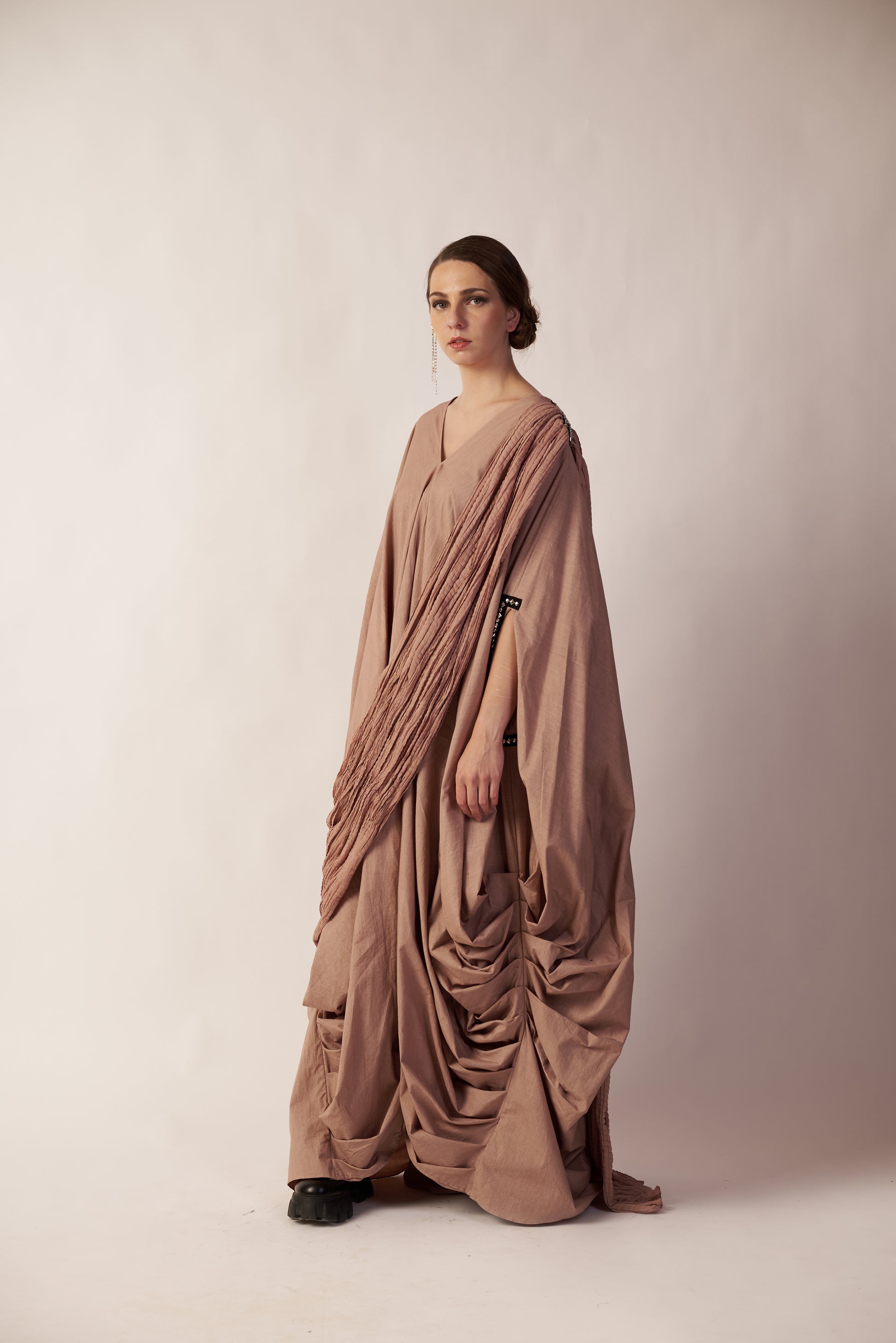 Woman wearing a flowing beige dress  | Women Dresses | Pret Clothes | nEo Clothes.
