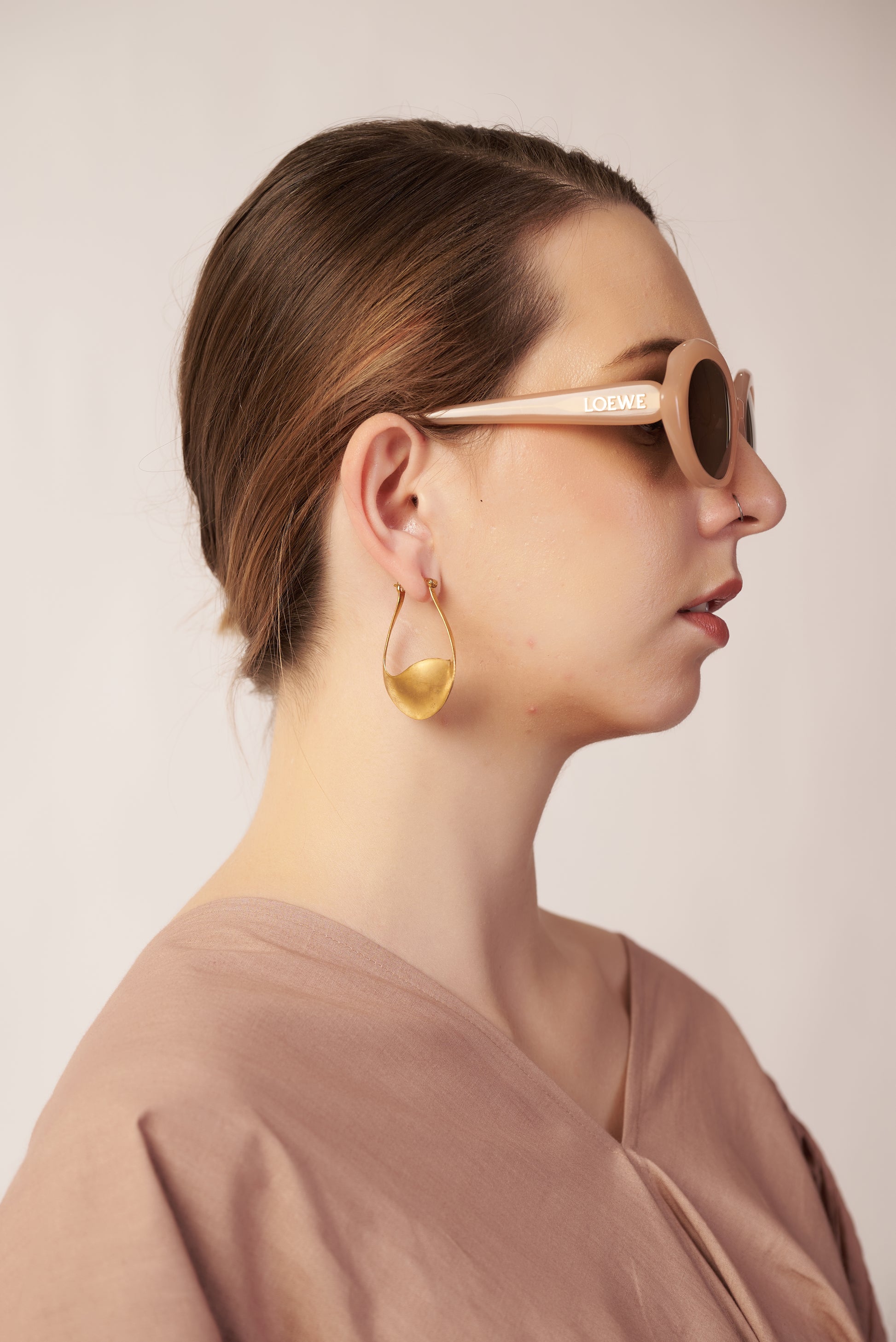 Woman wearing gold hoop earrings and sunglasses | Statement Earrings | neo jewelry 