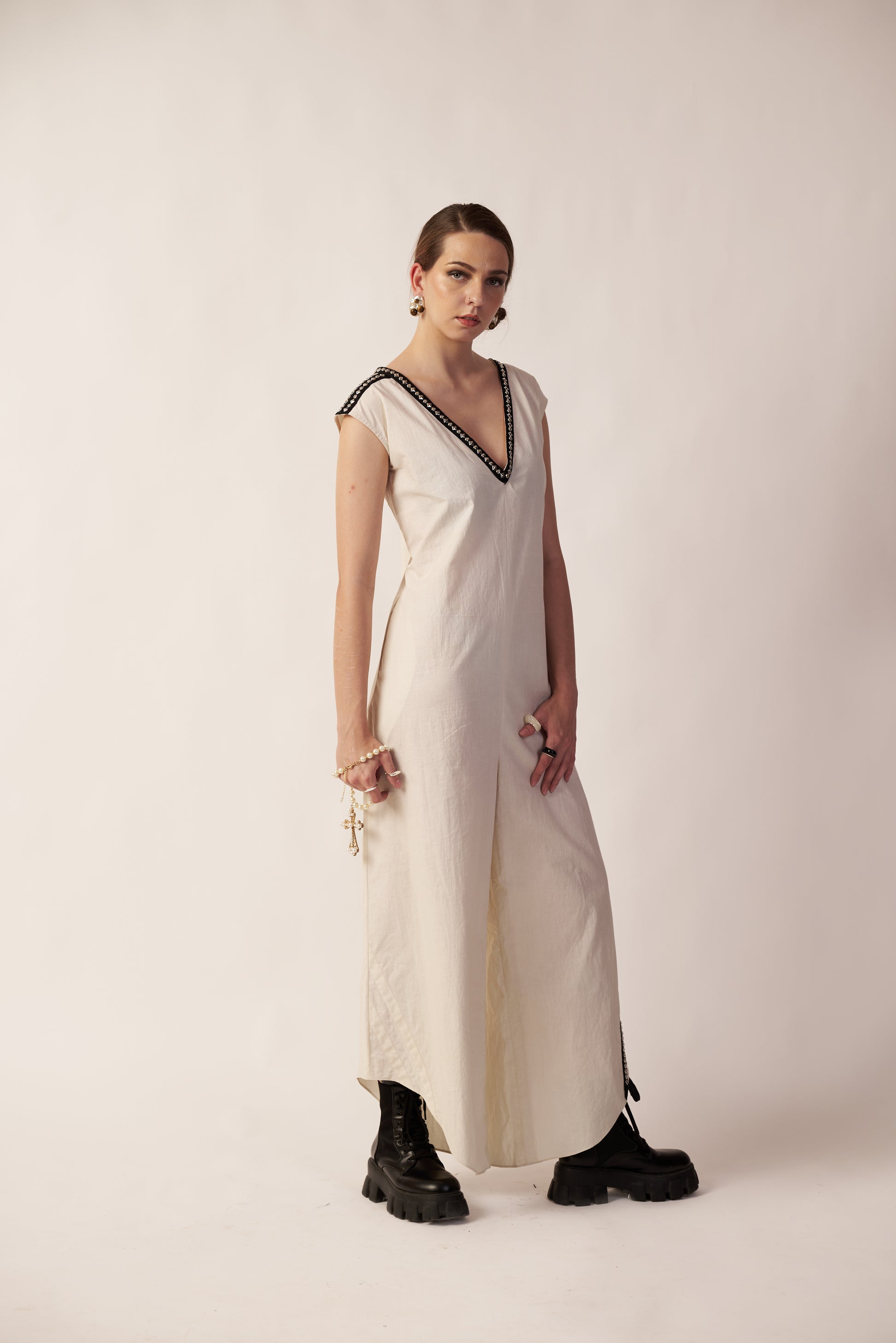 Woman wearing a white dress with black trim  | Women Jumpsuit | Pret Clothes | nEo Clothes.