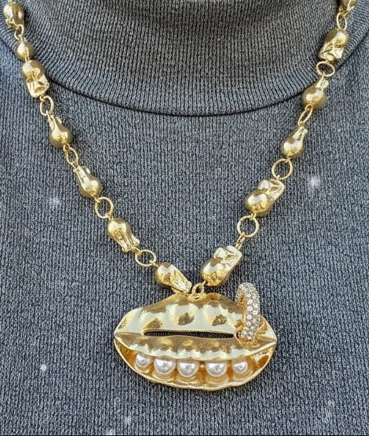 Model wearing gold UFO pendant necklace with crystal detailing – futuristic fashion jewellery by Near Earth Object