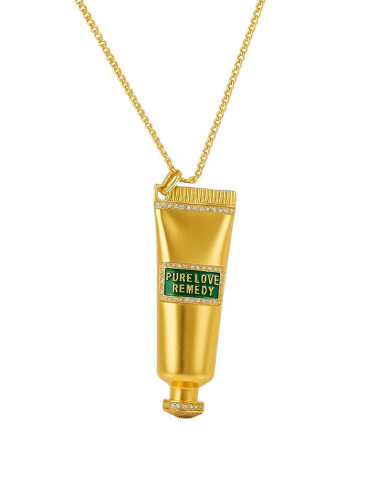 Gold tube-shaped pendant with 'PURE LOVE REMEDY'  | Statement Necklace & Chokers  | neo jewelry 