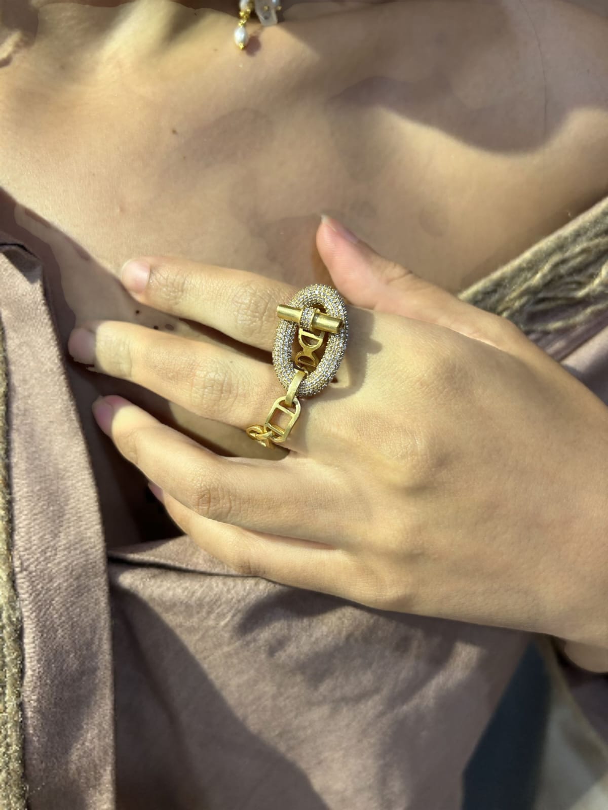 Close-up of a hand wearing a gold ring | Statement Ring | Asymmetrical Ring  | neo jewelry 