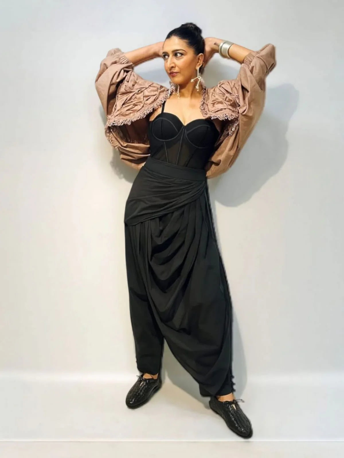 Person wearing a black outfit with a beige shrug | Women's Shrug | Jacket | Pret Clothes | nEo Clothes.