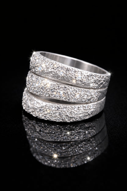 Near Earth Object | Silver ring with multiple bands on a black background
