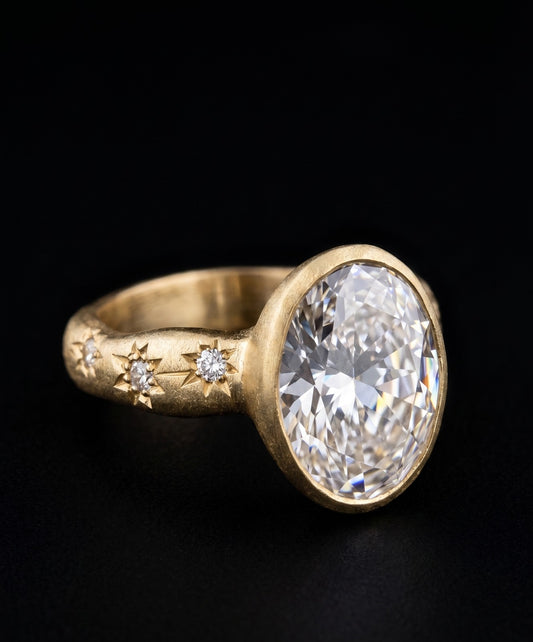 Near Earth Object | Gold ring with a large diamond and smaller diamonds on the band against a black background