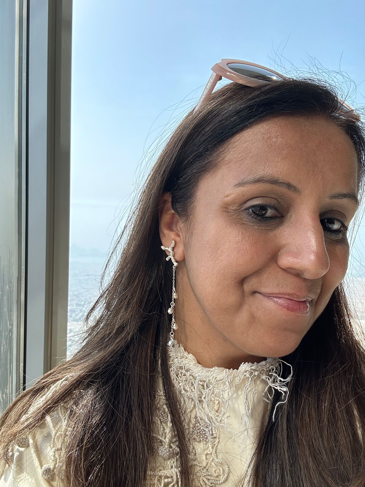 Woman with sunglasses on head, wearing a Silver Earrings | Statement Earrings | neo jewelry 