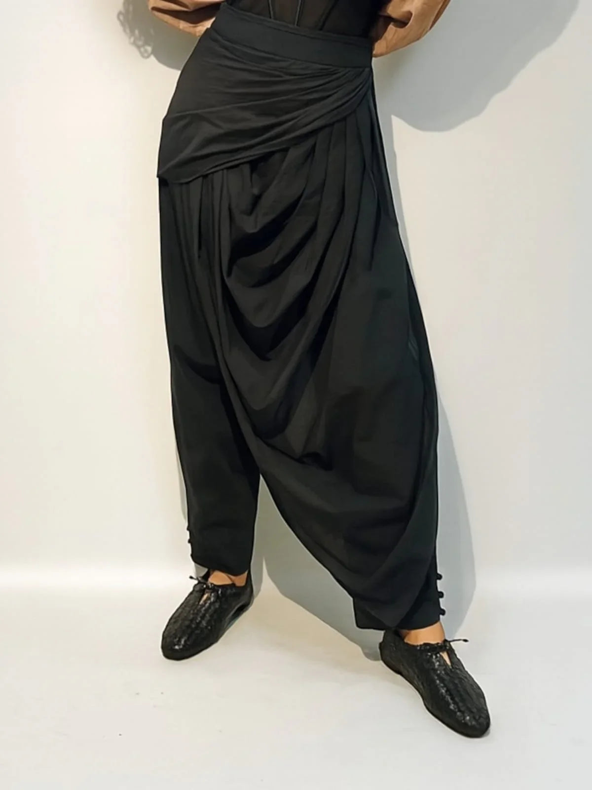 Person wearing black draped design pants and black shoes | Women's Pant | Pret Clothes | nEo Clothes