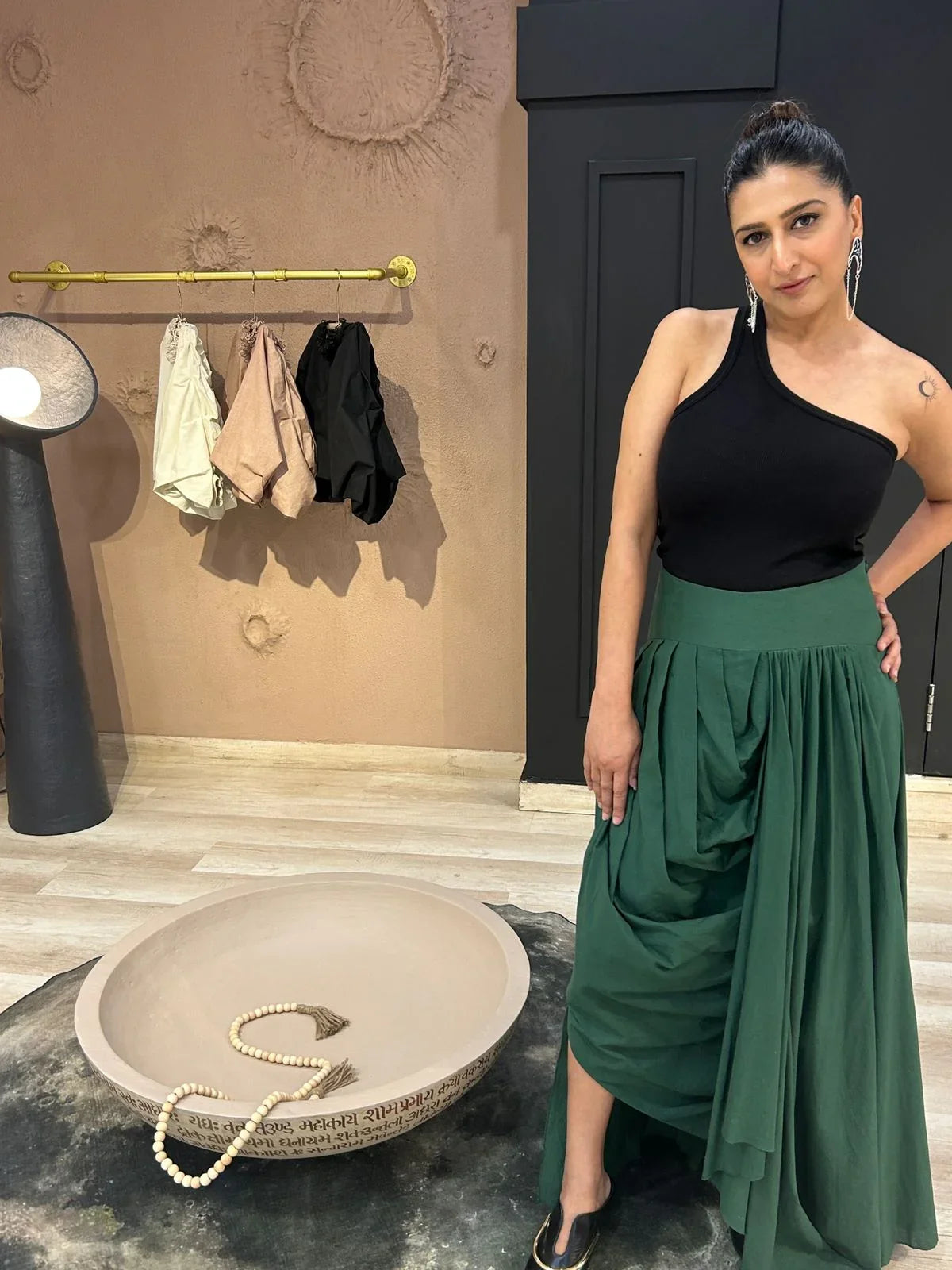 Woman in a black top and dark green skirt | Women's Skirt | Pret Clothes | nEo Clothes