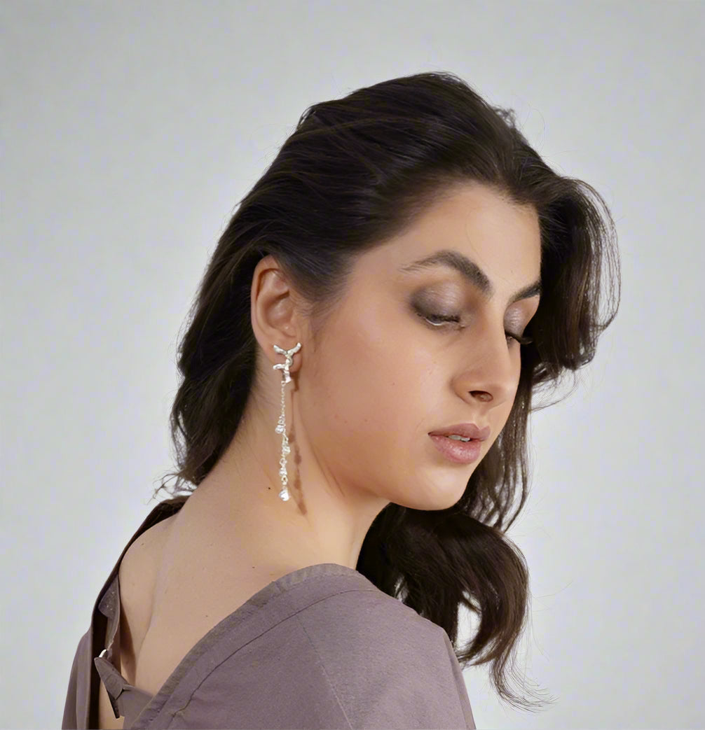 Woman wearing silver elegant earrings  | Statement Earrings | neo jewelry 