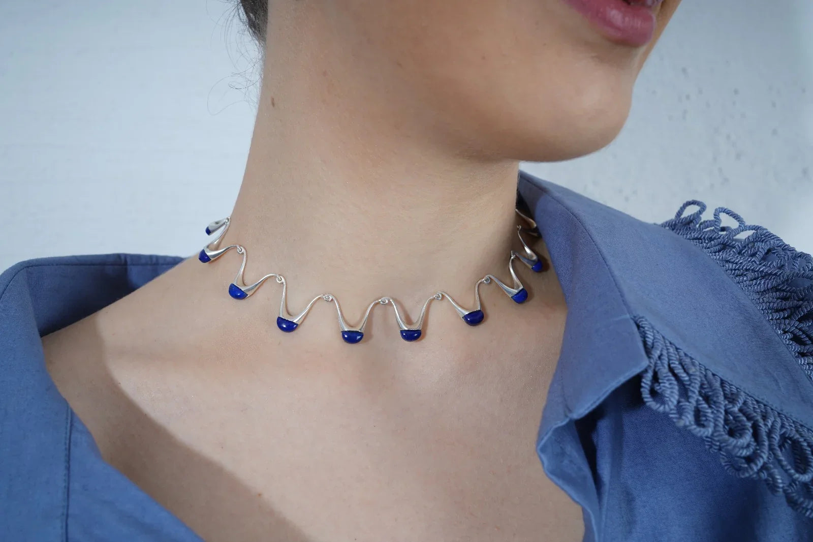 Person wearing a blue and silver necklace  | Statement Necklace & Chokers  | neo jewelry 
