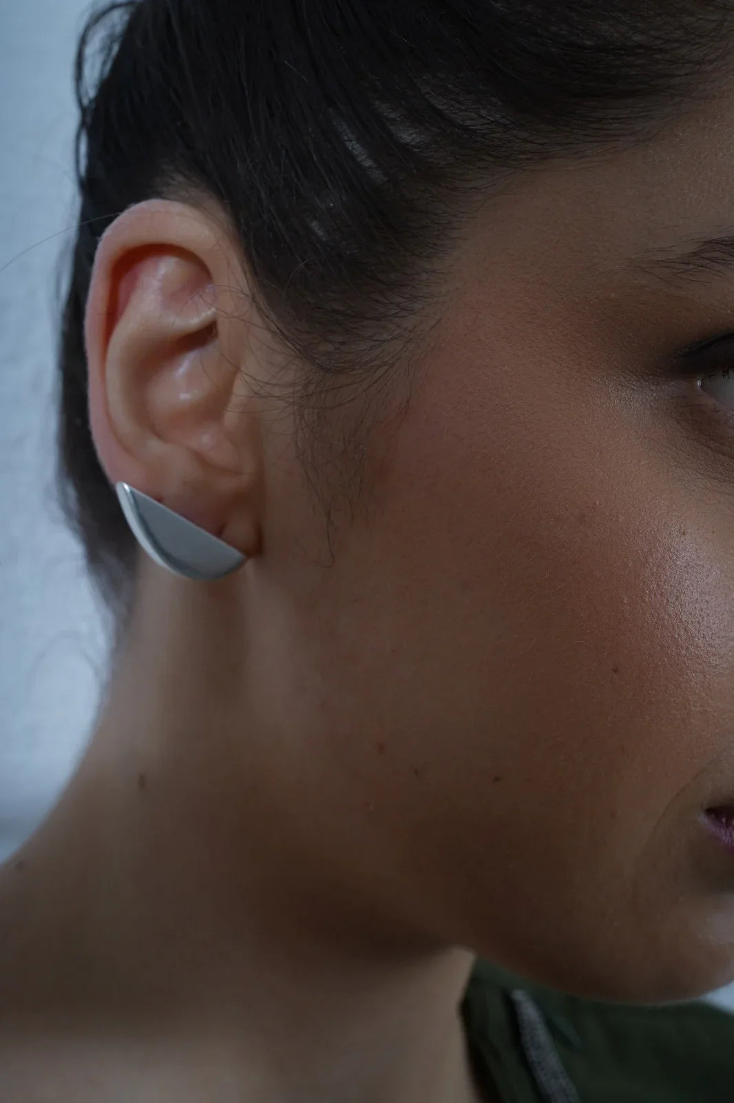 Close-up of a person wearing a Minimalist crescent shaped silver ear cuffs for daily wear.| Statement Ear Cuffs | neo jewelry 