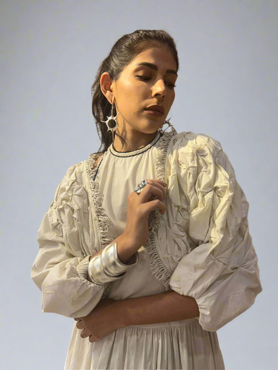 Woman wearing a white Shrug with ruffled details | Women's Overlay & Camisole | Jacket | Pret Clothes | nEo Clothes.