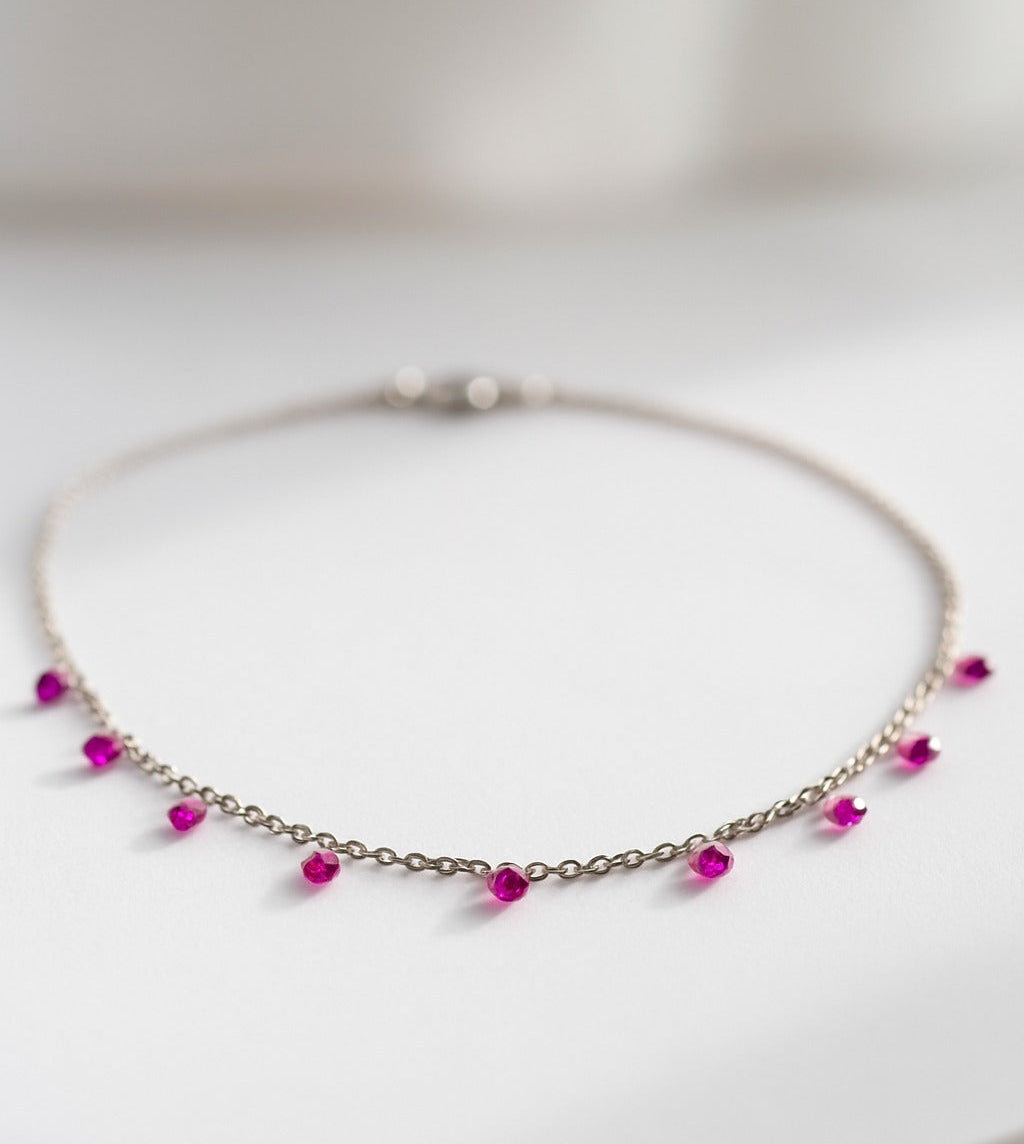 Necklace with pink beads on a white background