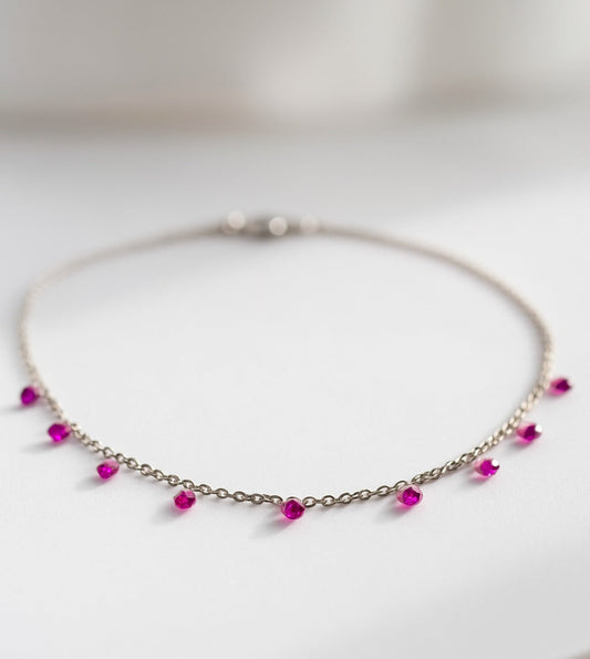 Necklace with pink beads on a white background