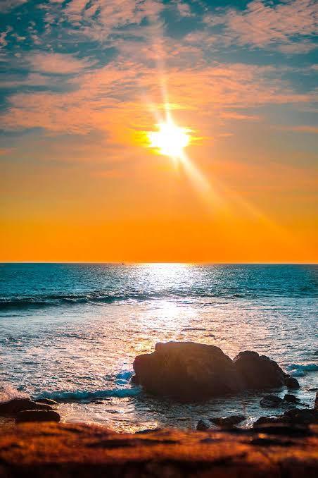 Sunset over the ocean with rocks in the foreground | Statement Ring | Asymmetrical Ring | neo jewelry 